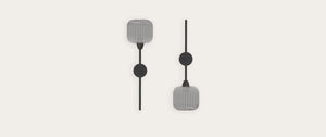 Robin Blueberry Wall light in grey, shown in a room setting