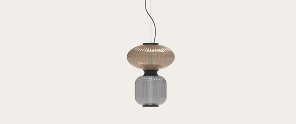 Robin Goldenberry Pendant in amber and grey, shown in a room setting